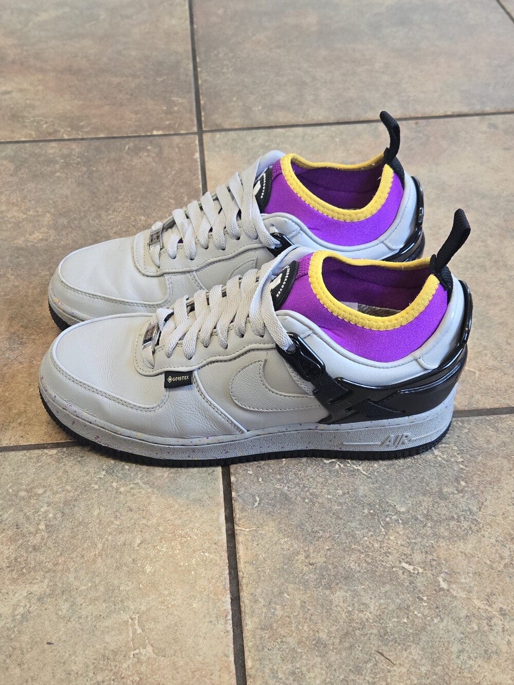Nike Men’s Grey Leather Athletic Sneakers with Purple & Yellow Accents 7.5